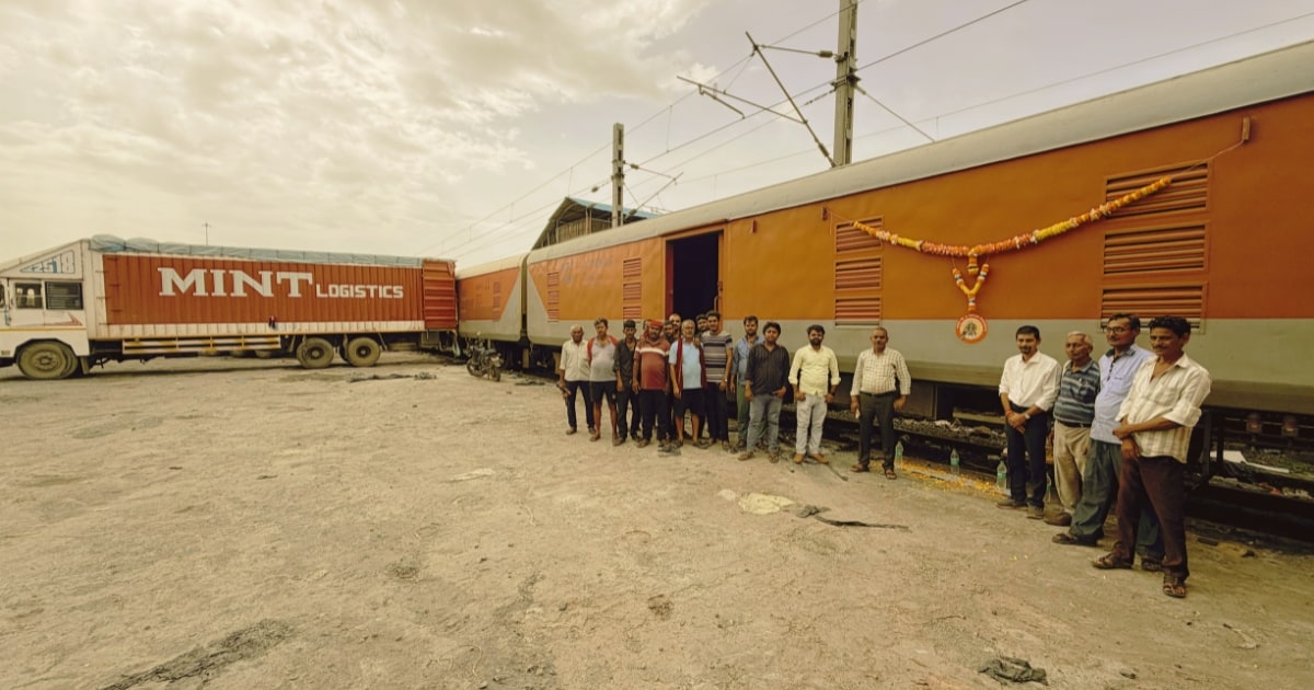 MINT Logistics team at the inaugural run of Central Railway's Mumbai–Guwahati JPP-RCS Rail cargo service, with a MINT truck alongside the garlanded parcel rake